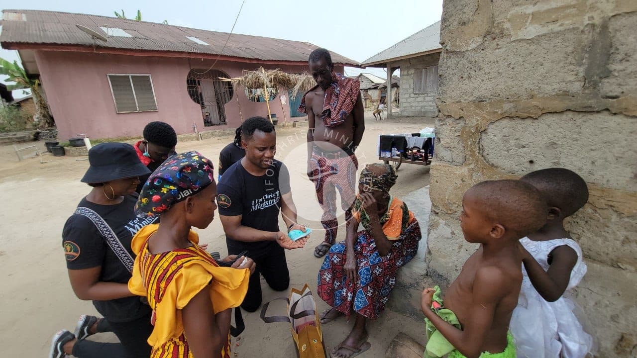 Sharing gifts and face masks with a family.