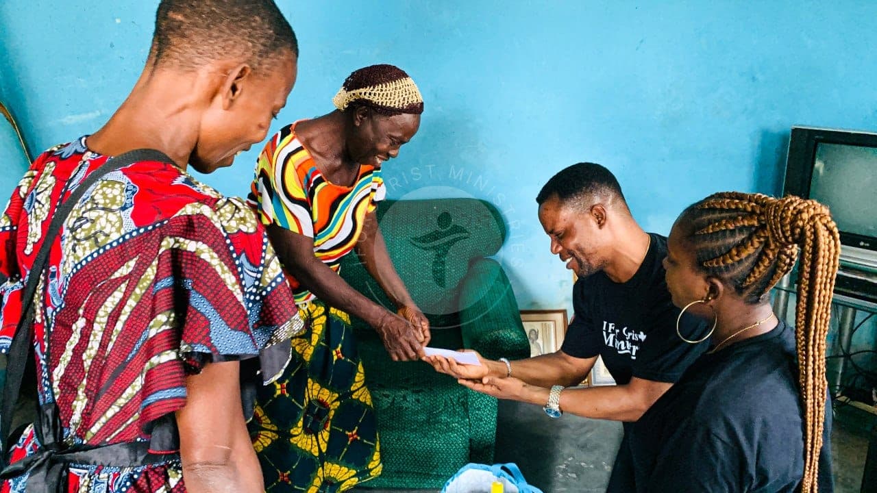 Handing over a gift during a home visit.